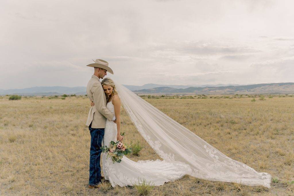 bride and groom embracing one another at one of the best wedding venues in Fort Collins, Colorado