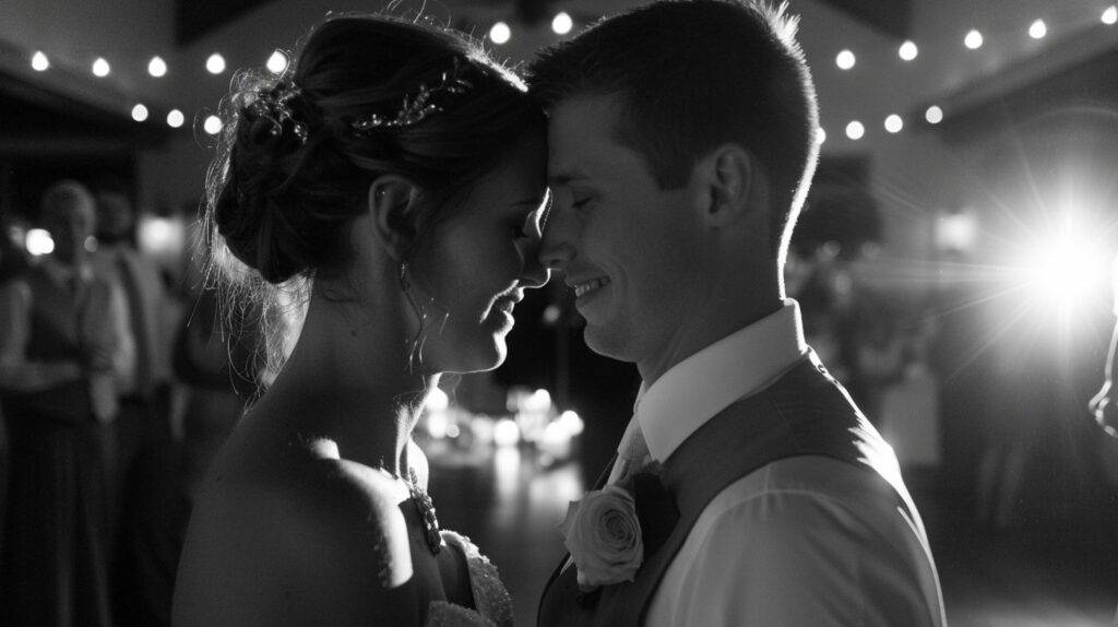 A newlywed couple shares an intimate embrace at their wedding reception.