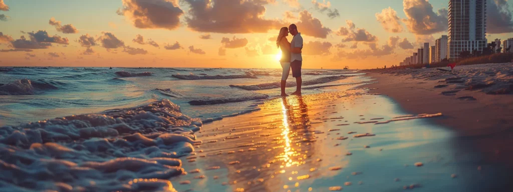 capture a couple standing on the beautiful miami beach at sunset, embracing each other, with a professional photographer adjusting their camera settings to capture the perfect shot.